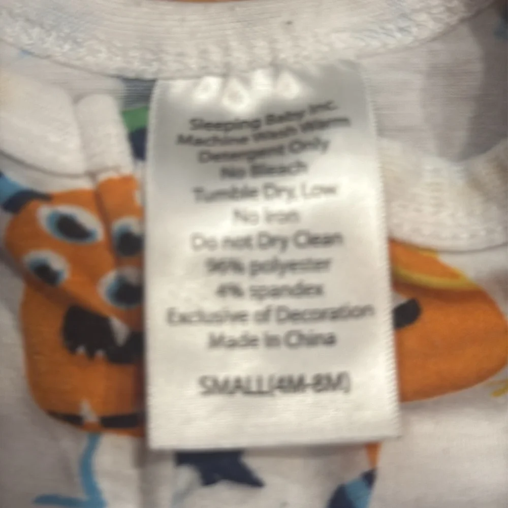Sleeping baby Zipadee-zip mister boys sleep sack size 4-8 months.